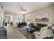 Open-concept living area with ample natural light, neutral tones, and stylish furnishings at 11650 W Pincushion Ct, Surprise, AZ 85378