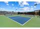 Well-maintained outdoor pickleball courts with blue and green surfaces at 11650 W Pincushion Ct, Surprise, AZ 85378
