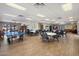 Spacious recreation room with tables, chairs, pool table and comfortable seating areas at 11650 W Pincushion Ct, Surprise, AZ 85378