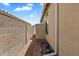 A brick-lined side yard featuring a storage shed and rock landscaping at 11650 W Pincushion Ct, Surprise, AZ 85378