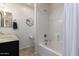 Bright bathroom featuring a shower-tub combo, modern vanity, and tiled flooring at 1170 E Jardin Dr, Casa Grande, AZ 85122