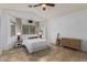 Bright bedroom featuring vaulted ceilings, neutral colors, and a large window for natural light at 1170 E Jardin Dr, Casa Grande, AZ 85122