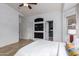 Bright bedroom featuring vaulted ceilings, neutral colors, and a large window for natural light at 1170 E Jardin Dr, Casa Grande, AZ 85122