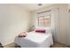 Cozy bedroom with a comfortable bed, soft lighting, and a window covered with sheer curtains at 1170 E Jardin Dr, Casa Grande, AZ 85122