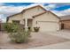 Lovely single-story home with desert landscaping and an attached two-car garage at 1170 E Jardin Dr, Casa Grande, AZ 85122