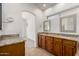 Bright bathroom includes double sinks with granite countertops and a soaking tub at 11808 E Clinton St, Scottsdale, AZ 85259