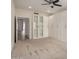 Neutral bedroom features built-in shelving units and access to other rooms at 11808 E Clinton St, Scottsdale, AZ 85259