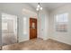 Bright entryway with light tile floors, a wood door, and access to another room at 11808 E Clinton St, Scottsdale, AZ 85259