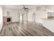 Spacious living room with modern flooring, fireplace, and access to the outdoor pool area at 11808 E Clinton St, Scottsdale, AZ 85259