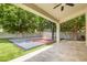 Covered patio with sports court in backyard; perfect for entertaining guests at 1253 E Ivanhoe Ct, Gilbert, AZ 85295