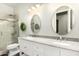 Bathroom featuring a double vanity with granite countertops and a glass enclosed shower at 1253 E Ivanhoe Ct, Gilbert, AZ 85295
