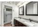 Beautiful bathroom featuring a double vanity with granite countertops and a tiled walk-in shower at 1253 E Ivanhoe Ct, Gilbert, AZ 85295