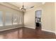 Dining room with hardwood floors, modern chandelier, and kitchen access at 1253 E Ivanhoe Ct, Gilbert, AZ 85295
