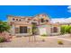 Two-story home showcasing a clay tile roof, stucco siding, and desert landscaping at 1253 E Ivanhoe Ct, Gilbert, AZ 85295