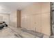 Spacious garage with built-in storage cabinets along one wall, perfect for organization and convenience at 1253 E Ivanhoe Ct, Gilbert, AZ 85295
