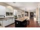Kitchen features granite countertops, island, and white cabinets at 1253 E Ivanhoe Ct, Gilbert, AZ 85295