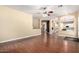 Open-concept living room with hardwood floors connecting to kitchen and hallways at 1253 E Ivanhoe Ct, Gilbert, AZ 85295
