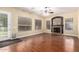 Bright living room with hardwood floors, fireplace, and backyard access at 1253 E Ivanhoe Ct, Gilbert, AZ 85295