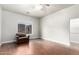 Cozy living room features hardwood floors, a ceiling fan, and natural light at 1253 E Ivanhoe Ct, Gilbert, AZ 85295