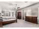 Spacious main bedroom with sitting area, carpet, and plentiful natural light at 1253 E Ivanhoe Ct, Gilbert, AZ 85295