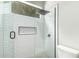 Elegant tiled shower with a glass surround and a modern shower head at 1253 E Ivanhoe Ct, Gilbert, AZ 85295