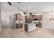 Modern kitchen featuring shaker cabinets, stainless steel appliances, an island, and an open layout design at 1333 E Bermuda Bay Ct, Gilbert, AZ 85234