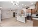 Open living space with updated kitchen, stainless appliances, an island, and seamless transition to living area at 1333 E Bermuda Bay Ct, Gilbert, AZ 85234