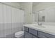 Bathroom features a gray vanity with white countertops and a shower with a striped curtain at 14870 W Encanto Blvd # 1061, Goodyear, AZ 85395