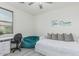 Cozy bedroom furnished with a desk, beanbag chair, and bed, enhanced by natural light at 14870 W Encanto Blvd # 1061, Goodyear, AZ 85395