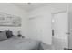 Relaxing bedroom showcasing a closet, a comfortable bed, and modern style at 14870 W Encanto Blvd # 1061, Goodyear, AZ 85395