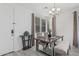 Cozy dining room features natural light, modern chandelier, a table with seating for four at 14870 W Encanto Blvd # 1061, Goodyear, AZ 85395