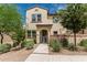 Charming two-story home featuring desert landscaping, a front gate and a private walkway at 14870 W Encanto Blvd # 1061, Goodyear, AZ 85395