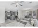 Open-concept living space combines the kitchen, dining area, and cozy living room with gray accents at 14870 W Encanto Blvd # 1061, Goodyear, AZ 85395