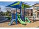A vibrant community playground featuring climbing structures, slides and a colorful sunshade at 14870 W Encanto Blvd # 1061, Goodyear, AZ 85395
