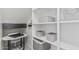 Organized storage space with built-in shelves, baskets, and a small desk area at 14870 W Encanto Blvd # 1061, Goodyear, AZ 85395