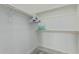 Walk-in closet with wooden rods, shelves, and ample storage space at 14870 W Encanto Blvd # 1061, Goodyear, AZ 85395