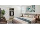 Comfortable bedroom with neutral tones, closet space, and stylish decor to create a welcoming ambiance at 15386 W Cottontail Ln, Surprise, AZ 85387