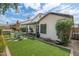 Back of home with a covered patio, artificial turf, and outdoor seating at 15815 N 4Th Dr, Phoenix, AZ 85023