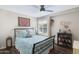 Cozy bedroom features a queen bed, ceiling fan and shuttered window at 15815 N 4Th Dr, Phoenix, AZ 85023