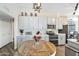 Spacious kitchen with modern lighting, appliances, and an eat-in kitchen area at 15815 N 4Th Dr, Phoenix, AZ 85023