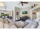 Spacious living room boasting hardwood floors, ceiling fan, comfortable furniture, and view into dining area at 15815 N 4Th Dr, Phoenix, AZ 85023