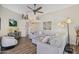 Bright living room with vaulted ceiling, ceiling fan, hardwood floors, and comfortable seating and lighting at 15815 N 4Th Dr, Phoenix, AZ 85023