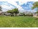 Expansive park with lush green lawn, mature trees, and picnic area, ideal for outdoor activities and relaxation at 15815 N 4Th Dr, Phoenix, AZ 85023