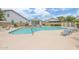 Community swimming pool with lounge chairs and well-maintained deck under a sunny sky at 15815 N 4Th Dr, Phoenix, AZ 85023
