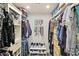 Walk-in closet featuring custom shelving, drawers, and ample hanging space for organization at 15815 N 4Th Dr, Phoenix, AZ 85023