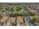 A high aerial neighborhood shot featuring desert landscaping and a nearby park at 15902 W Hearn Rd, Surprise, AZ 85379