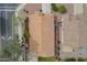 Birds-eye view of house with a tile roof, desert landscaping, and a small lawn at 15902 W Hearn Rd, Surprise, AZ 85379