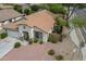 Aerial view of a cozy single-story home with a tile roof and desert landscaping at 15902 W Hearn Rd, Surprise, AZ 85379