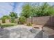 Beautiful backyard with a fire pit and bench seating, perfect for outdoor entertaining at 15902 W Hearn Rd, Surprise, AZ 85379