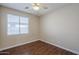Bedroom featuring wood-style flooring and a window with blinds at 15902 W Hearn Rd, Surprise, AZ 85379